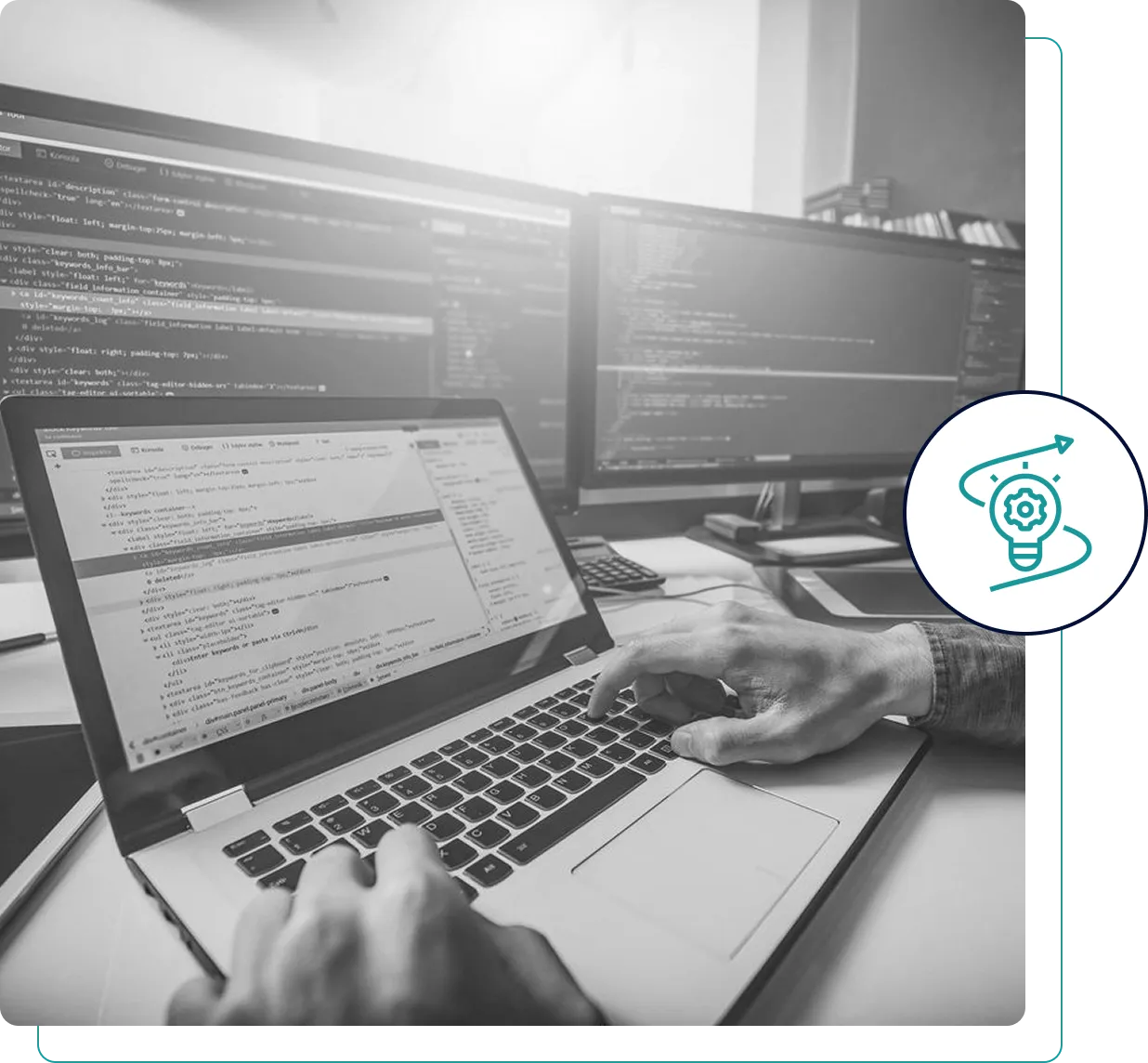 Person typing on a laptop with multiple screens displaying code.